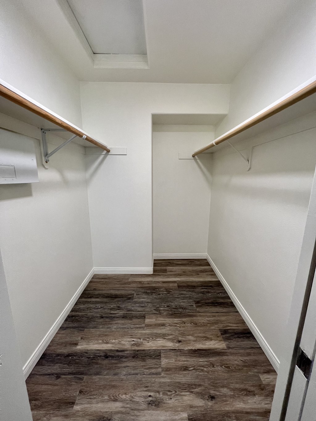 a walk in closet in a 555 waverly unit a walk in closet in a 555 waverly unit at Villa Mondavi, Bakersfield, 93312